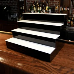 BarConic® LED Liquor Bottle Display Shelf - 4 Tier (Step) - Black - Multi-Colored Lights - Several Lengths -Endurance Sales led professional bar shelf 4 tier 24in unlit off